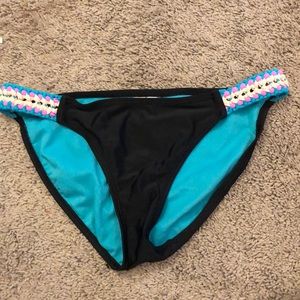 Black bikini bottoms with cute detailing on sides